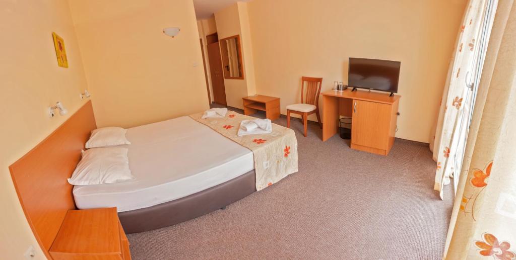 Postel nebo postele na pokoji v ubytování Hotel Eva