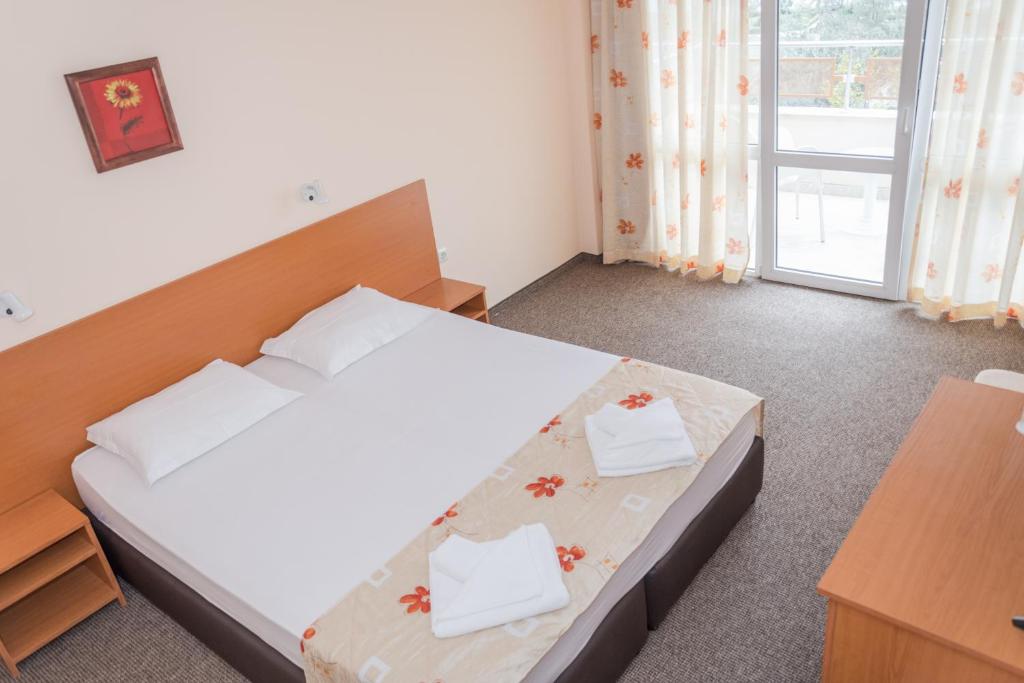Postel nebo postele na pokoji v ubytování Hotel Eva