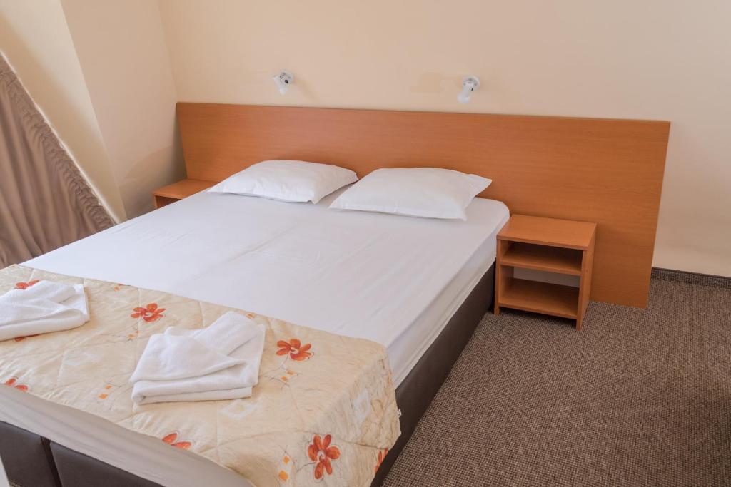 Postel nebo postele na pokoji v ubytování Hotel Eva