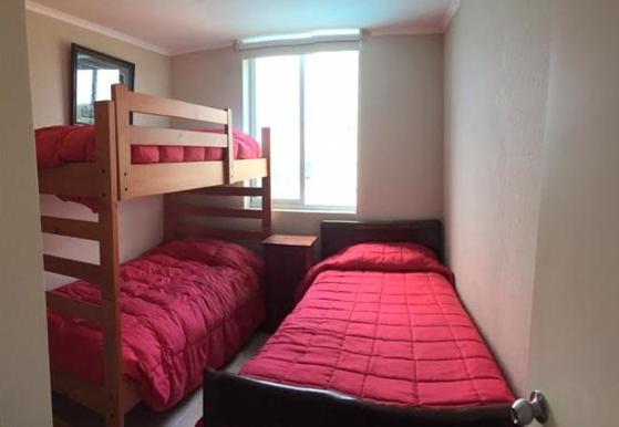 Una cama o camas en una habitación de Algarrobo Laguna Vista