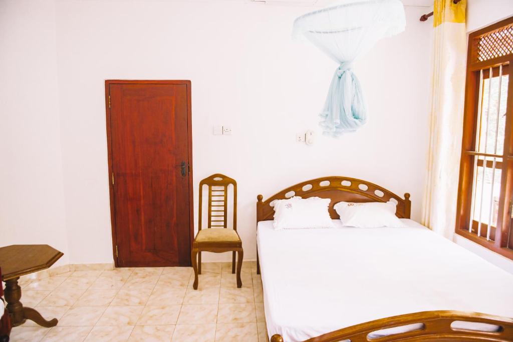 Postel nebo postele na pokoji v ubytování Kadolana Guest House