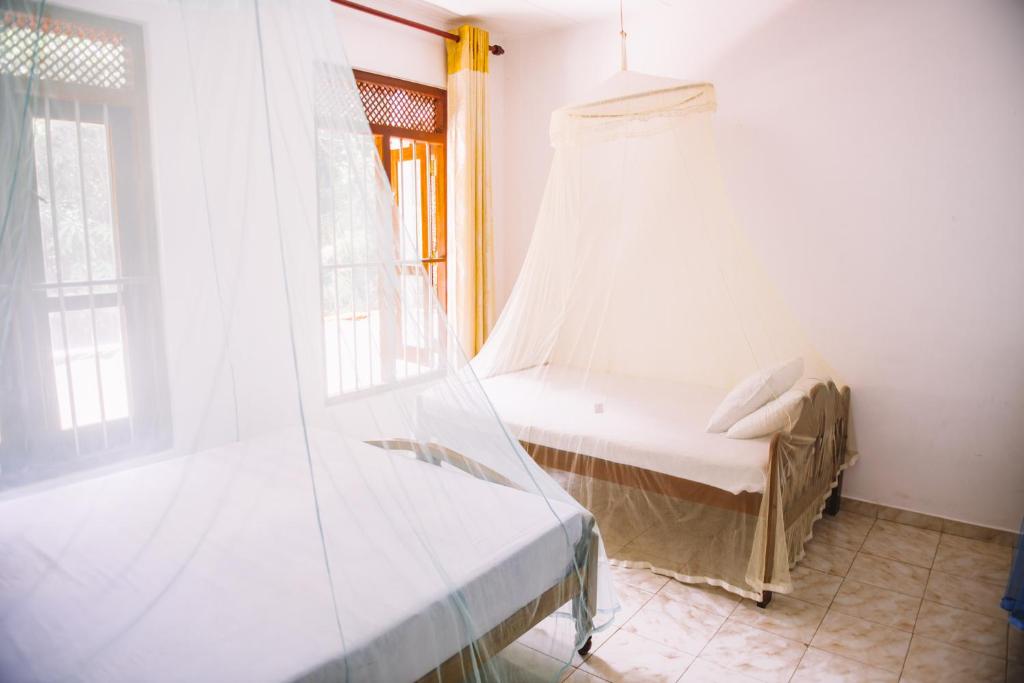 Postel nebo postele na pokoji v ubytování Kadolana Guest House