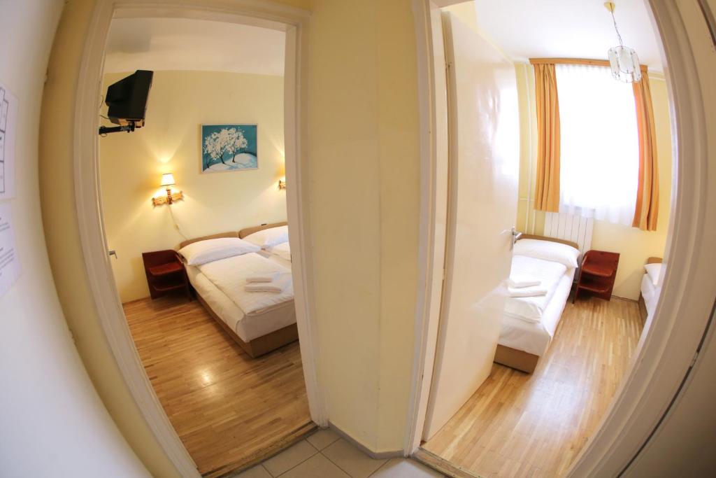 Postel nebo postele na pokoji v ubytování Hotel Bara Junior
