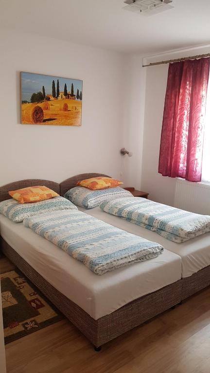 Posteľ alebo postele v izbe v ubytovaní Orchidea II