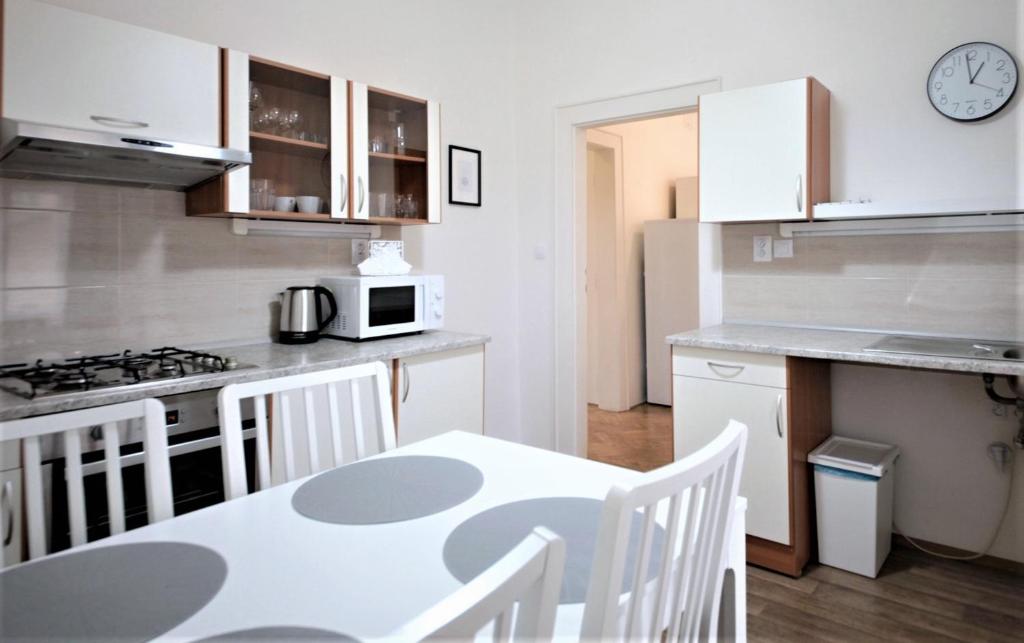 Kuchyň nebo kuchyňský kout v ubytování Angel City Aparthotel