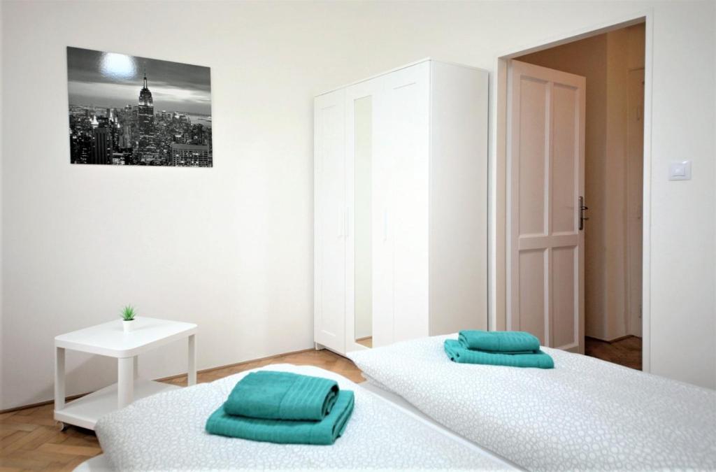 Postel nebo postele na pokoji v ubytování Angel City Aparthotel