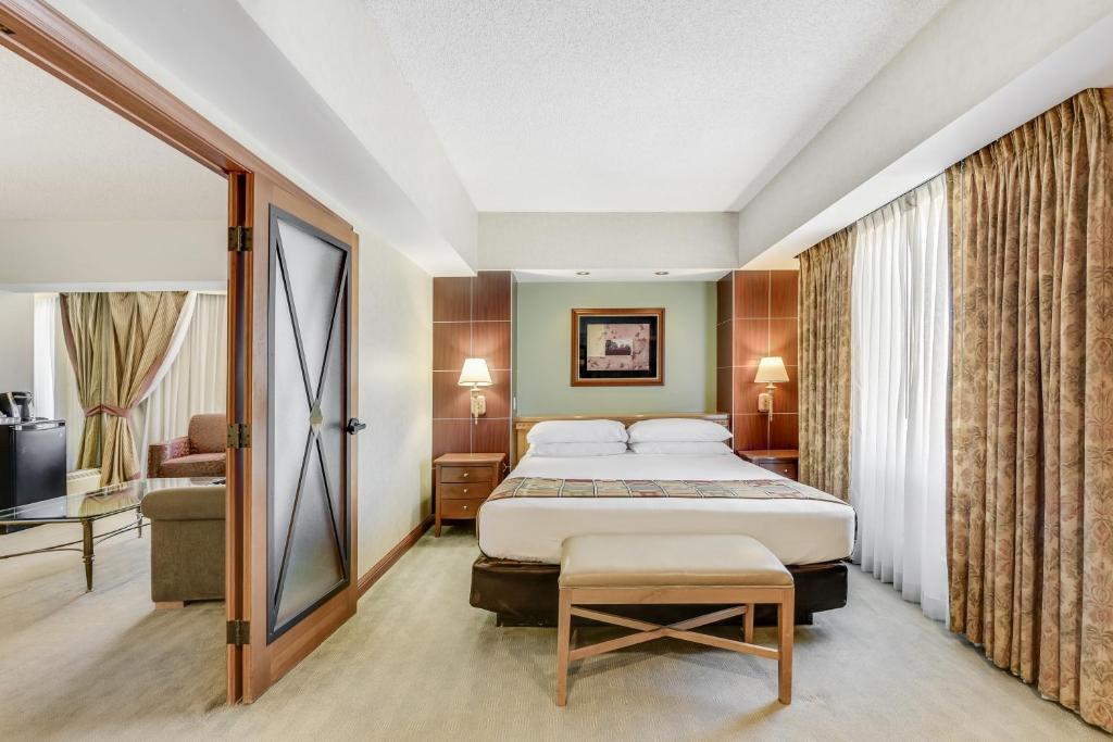 a hotel room with a bed and a television at Harrah's Lake Tahoe Hotel & Casino in Stateline