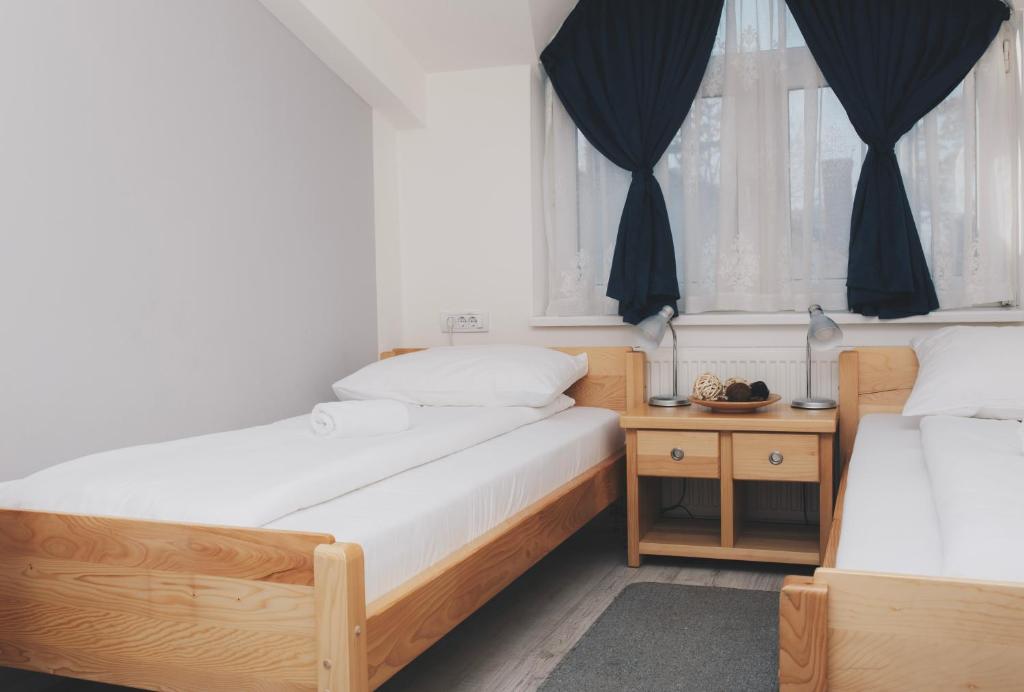 Postel nebo postele na pokoji v ubytování Bloom Inn
