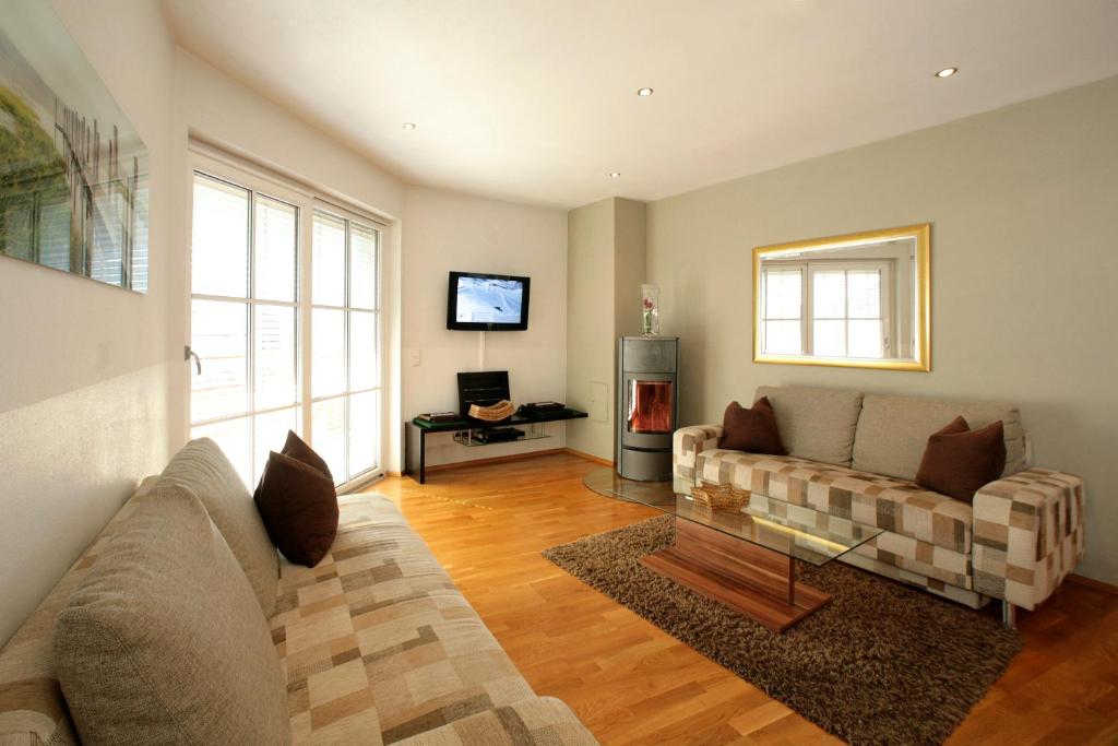 Televízia a/alebo spoločenská miestnosť v ubytovaní EXCLUSIVE APARTMENTS - inclusive Zell am See-Kaprun Sommerkarte und unbegrenztem Tauern SPA Eintritt