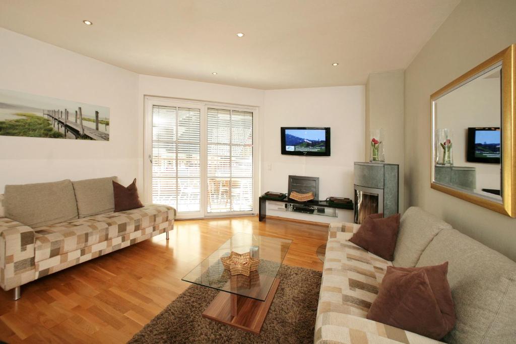 Televízia a/alebo spoločenská miestnosť v ubytovaní EXCLUSIVE APARTMENTS - inclusive Zell am See-Kaprun Sommerkarte und unbegrenztem Tauern SPA Eintritt
