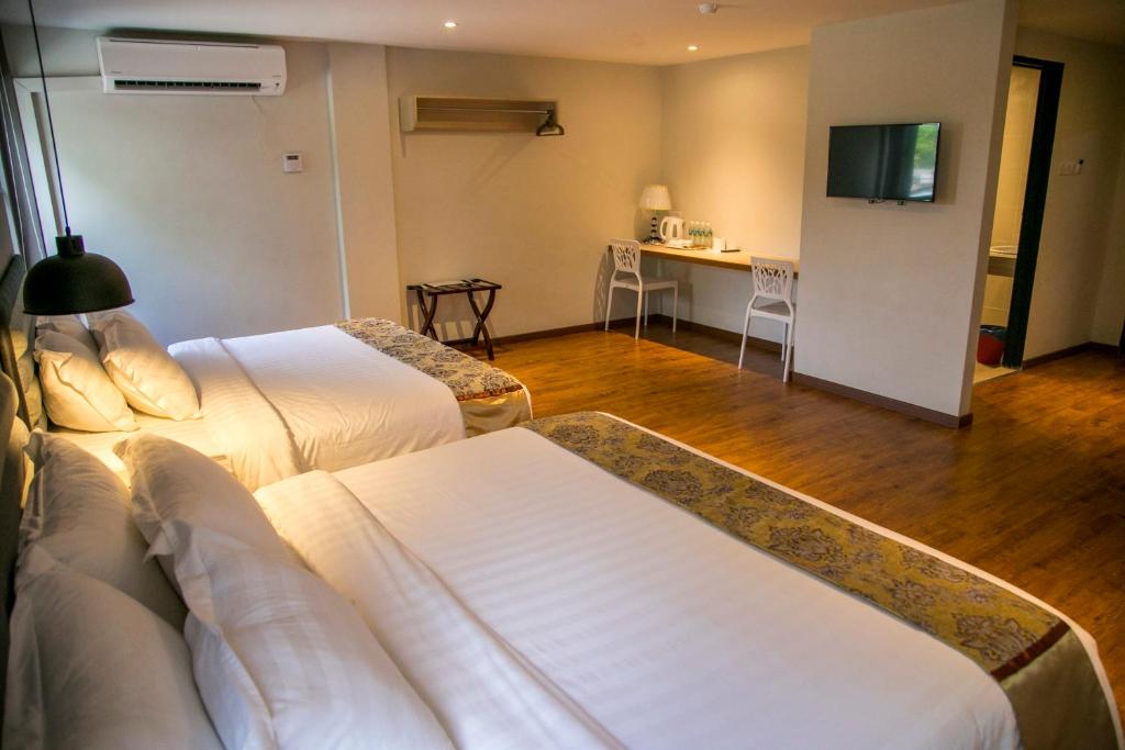 TV a/nebo společenská místnost v ubytování Apple Suites Hotel