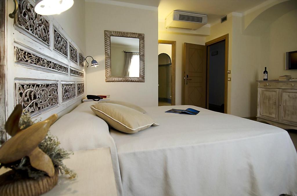 Postel nebo postele na pokoji v ubytování Dolce Vita Boutique Hotel