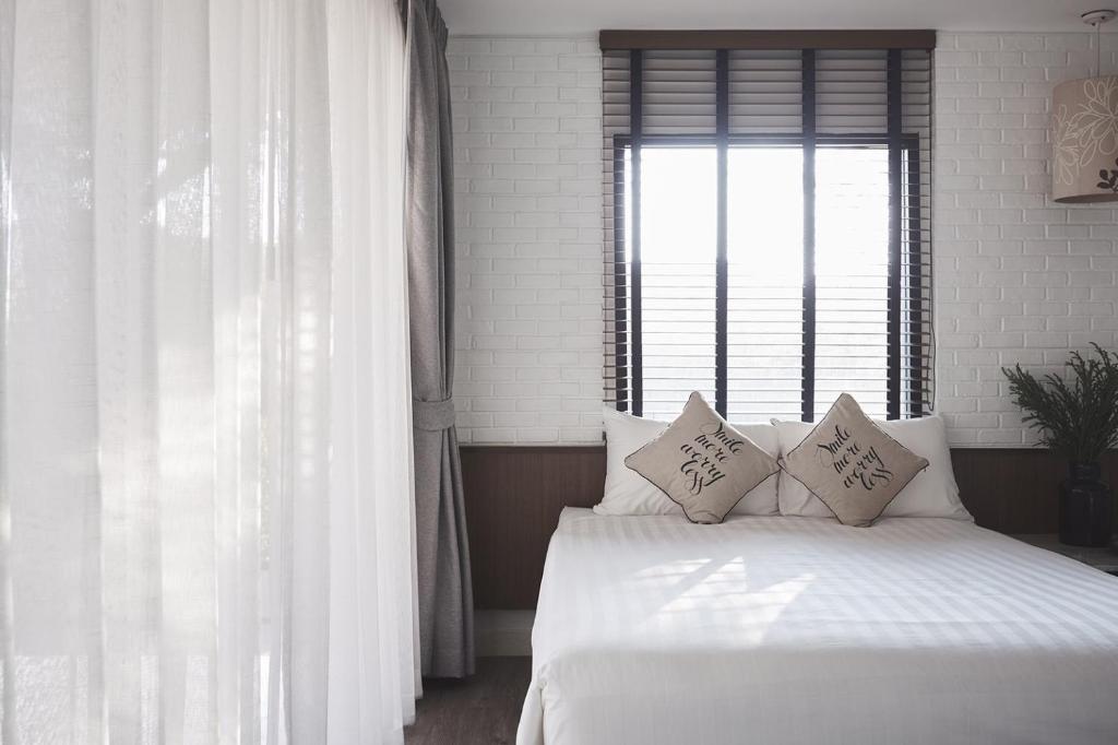 Postel nebo postele na pokoji v ubytování Siambeach Resort