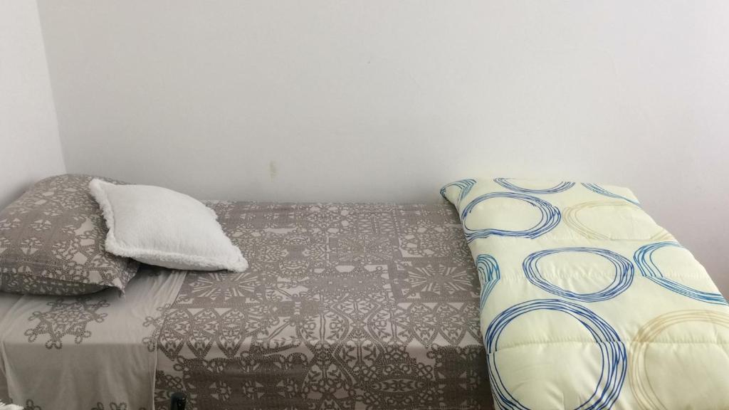 Una cama o camas en una habitación de Próximo ao Consulado - Quarto Inteiro