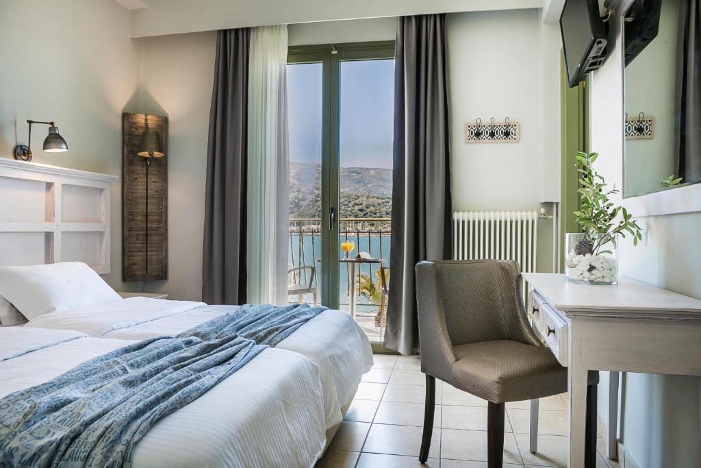 Postel nebo postele na pokoji v ubytování Tourist Boutique Hotel