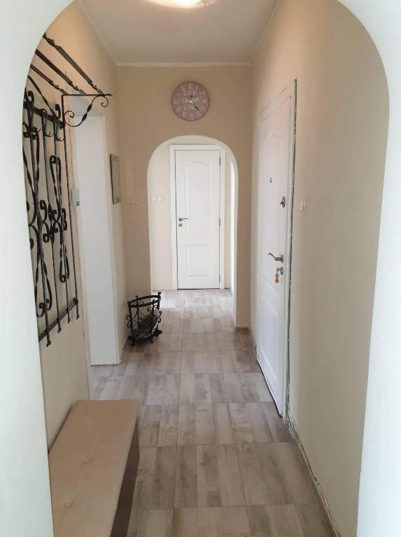 an empty hallway with a white door and a hallwayngth at Kalina apartment in Ruse