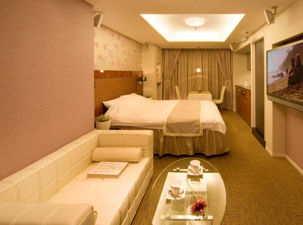 A bed or beds in a room at Carrot ISE (Adult Only)