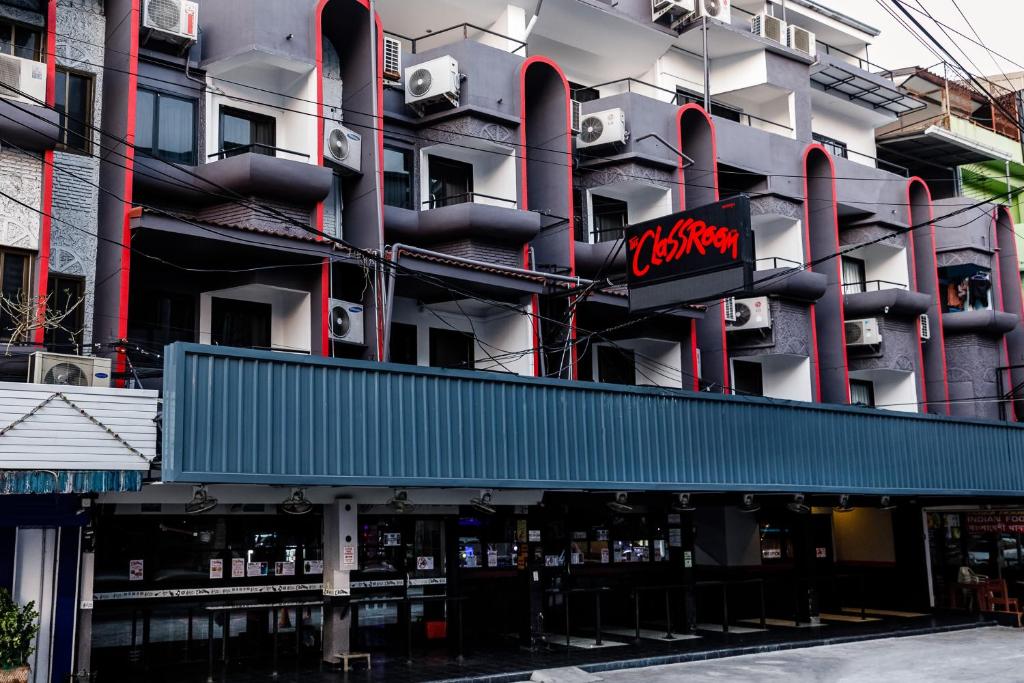 a building with a sign that reads krispy kreme at The Classroom Hotel in Pattaya