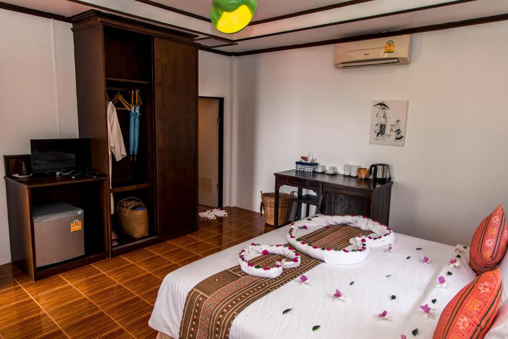 Postel nebo postele na pokoji v ubytování Zama Resort Koh Phangan