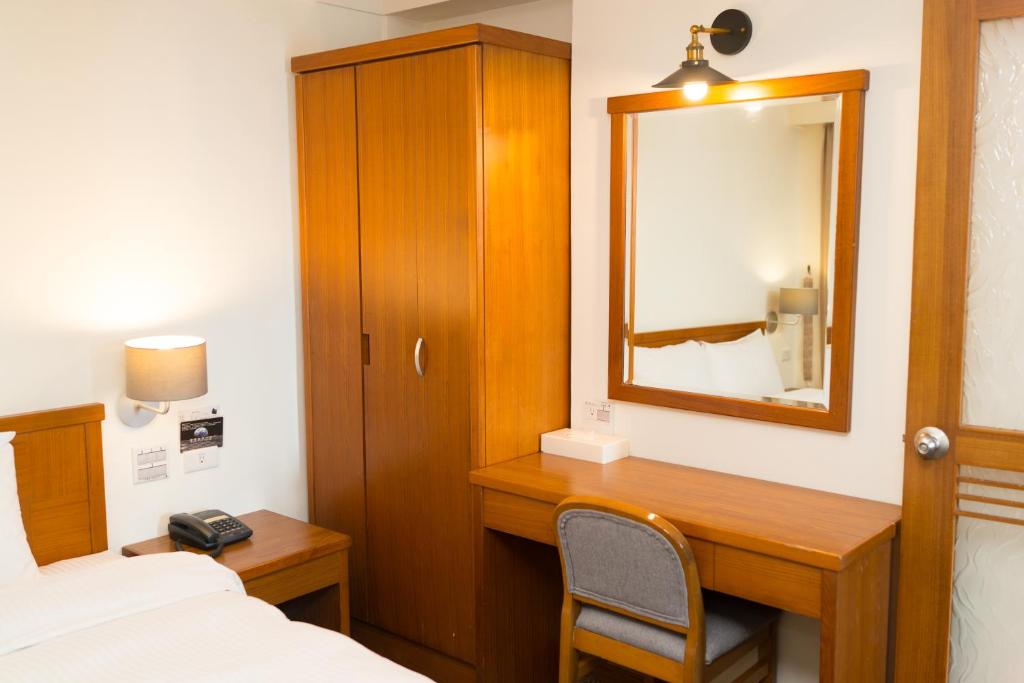 Postel nebo postele na pokoji v ubytování Bowa Hotel Penghu