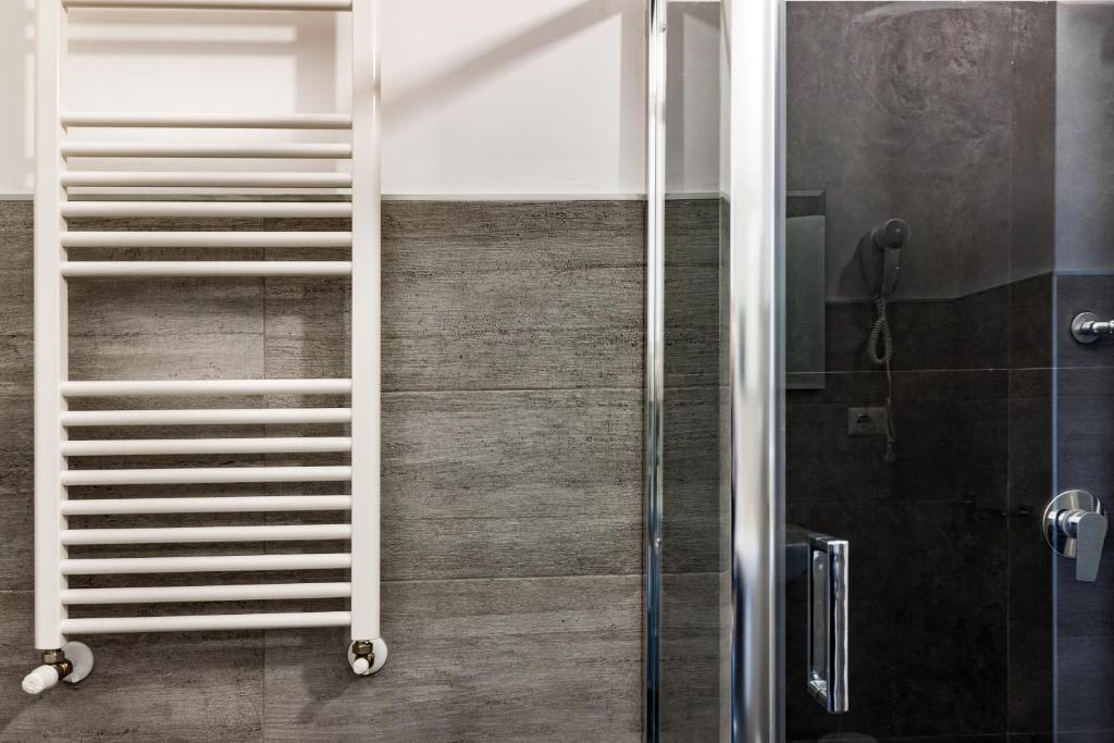 a shower with a white ladder in a bathroom at TRAVEL STATION Bedandbreakfast in Bari