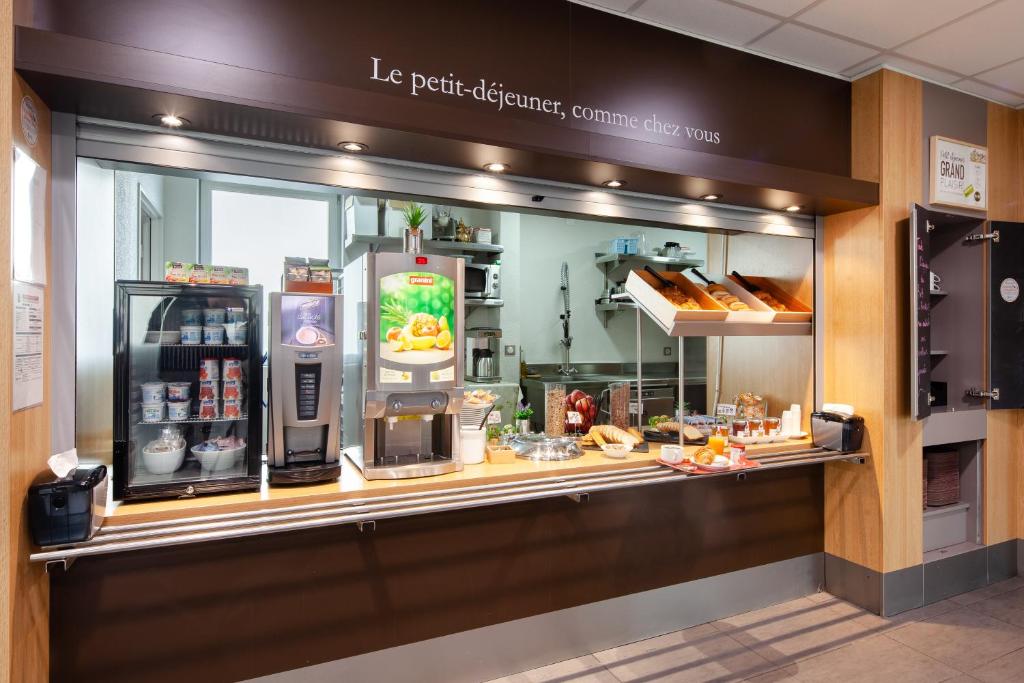 a store display window of a coffee shop at B&B HOTEL Paris Le Bourget in Le Bourget