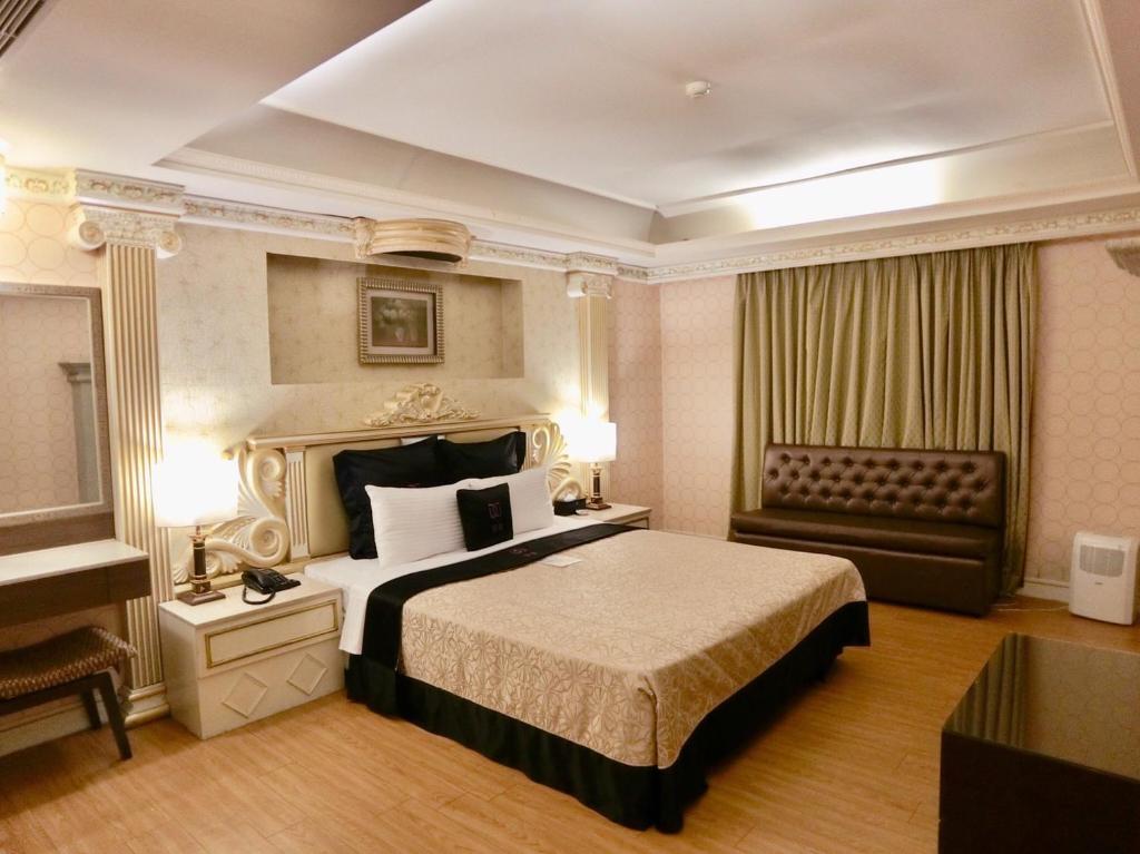 Postel nebo postele na pokoji v ubytování Discovery Motel - Yonghe