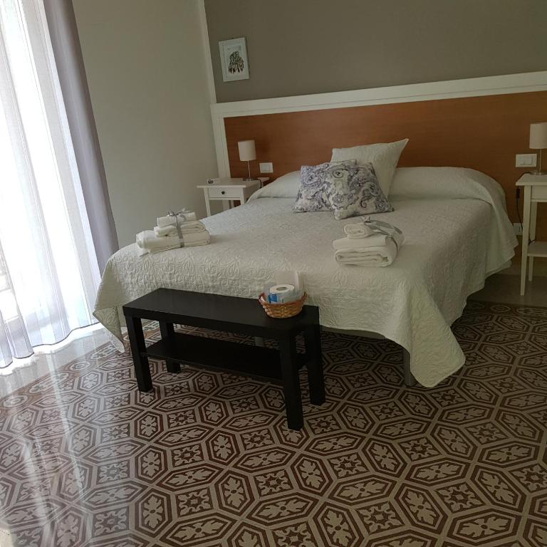 Postel nebo postele na pokoji v ubytování Aziz b&b