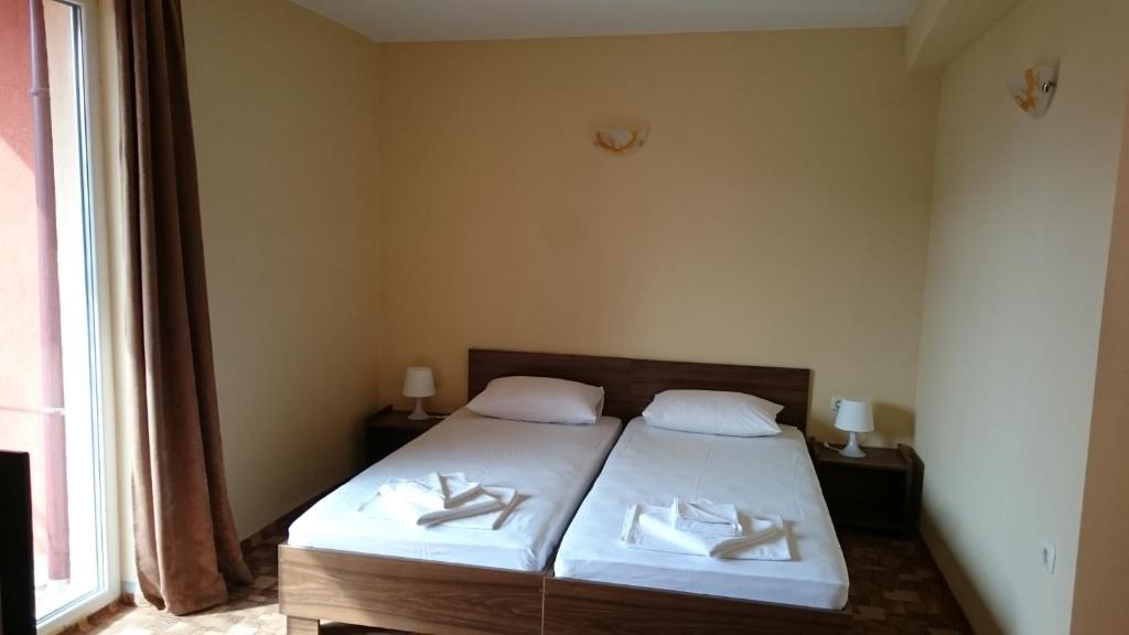 Postel nebo postele na pokoji v ubytování Hotel Sapphire