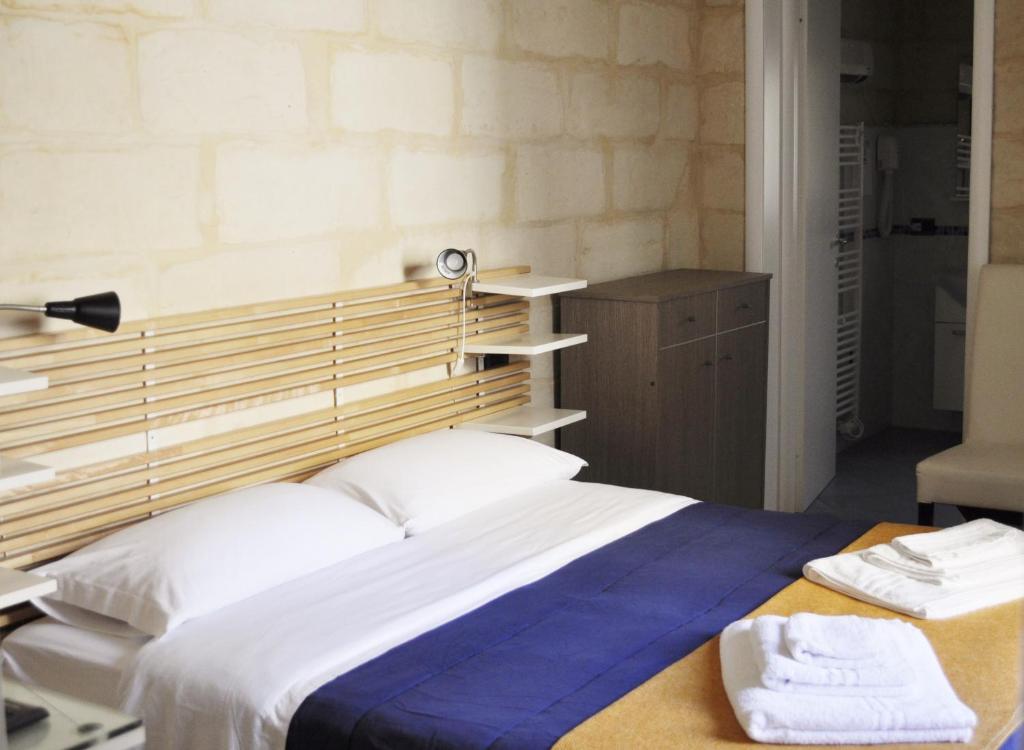 Postel nebo postele na pokoji v ubytování B&B Lecce Holidays