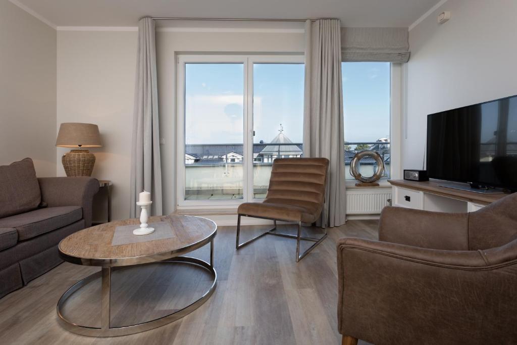 TV a/nebo společenská místnost v ubytování strandnahe FeWos mit Balkon, Residenz Bel Vital - Kategorie B