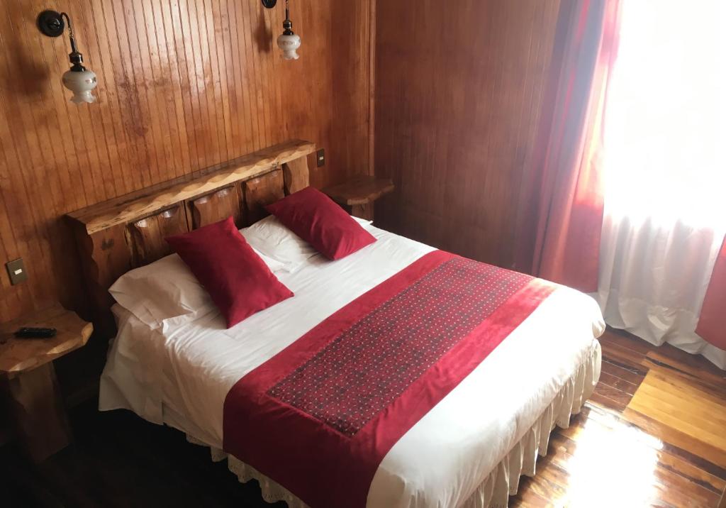 Postel nebo postele na pokoji v ubytování Hostal Buenaventura