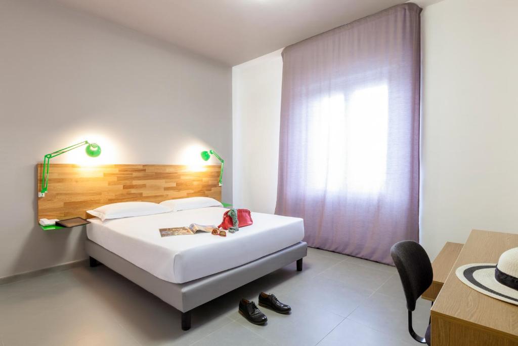 Postel nebo postele na pokoji v ubytování Ibis Styles Brindisi