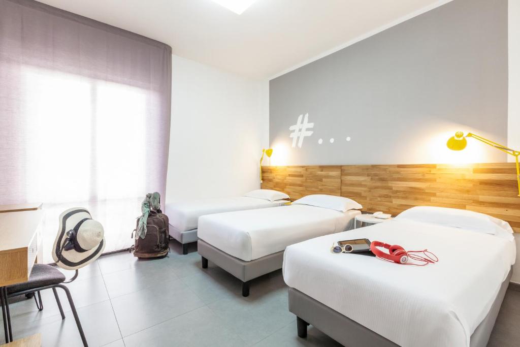 Postel nebo postele na pokoji v ubytování Ibis Styles Brindisi