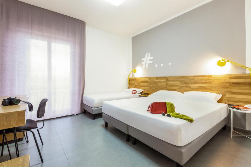 Postel nebo postele na pokoji v ubytování Ibis Styles Brindisi