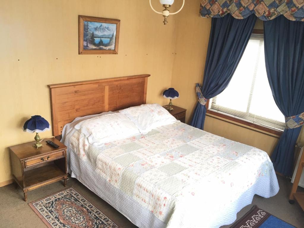 Postel nebo postele na pokoji v ubytování Hostal Buenaventura