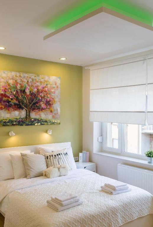 Łóżko lub łóżka w pokoju w obiekcie MirÓ Studio Apartments Zagreb