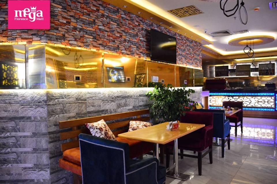 A restaurant or other place to eat at Mohamed Afifi Florence El Montazah - 2 Bed rooms - "Compound"