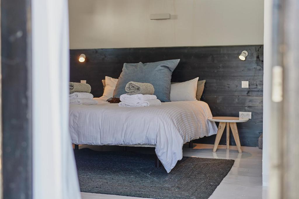 A bed or beds in a room at Finca Malvasia Rural Estate & Vineyard