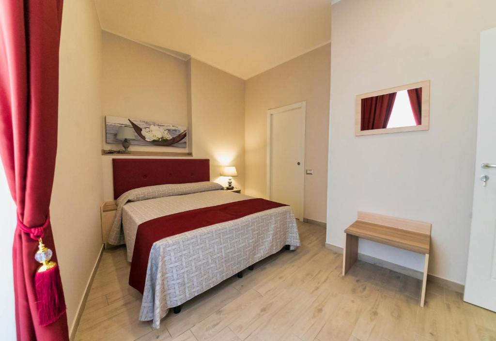 Postel nebo postele na pokoji v ubytování Hotel Balilla