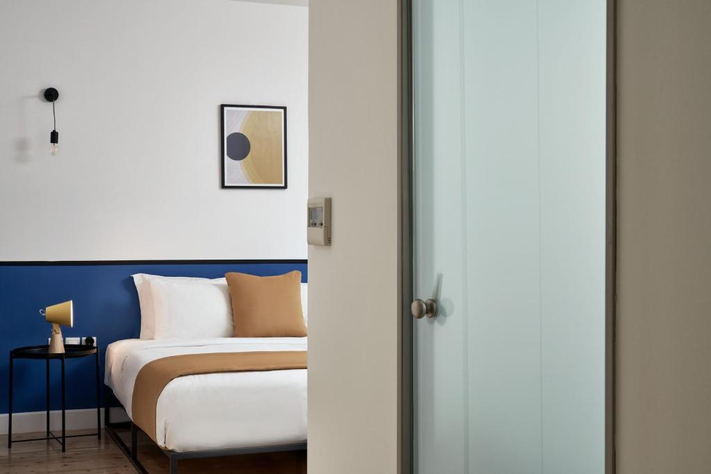 Posteľ alebo postele v izbe v ubytovaní MONO Lofts