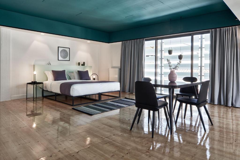 Posteľ alebo postele v izbe v ubytovaní MONO Lofts