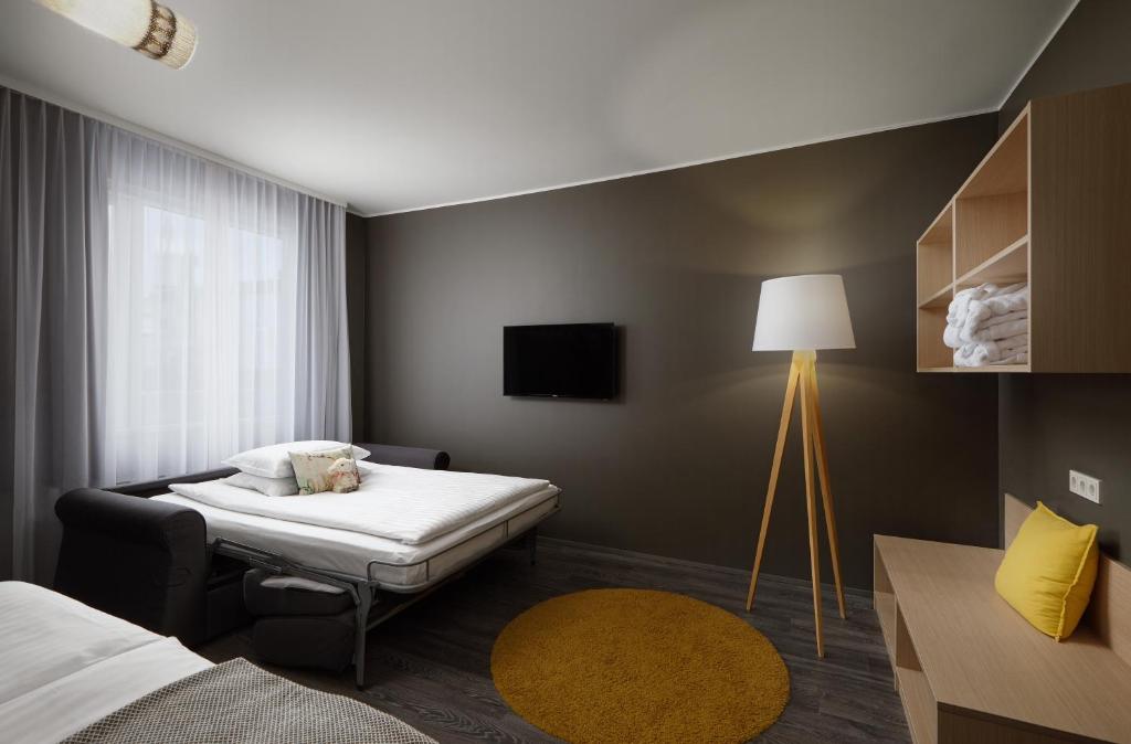 Postel nebo postele na pokoji v ubytování Alda Hotel Reykjavík