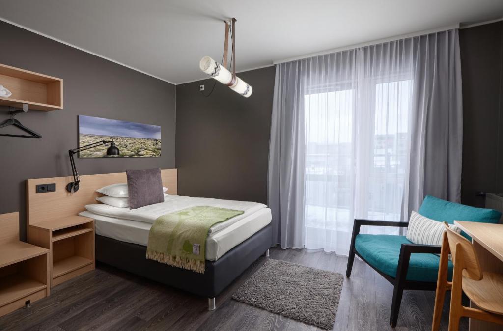 Postel nebo postele na pokoji v ubytování Alda Hotel Reykjavík