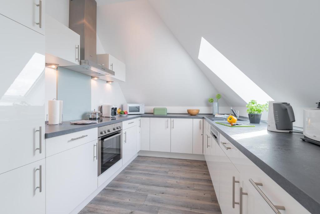 Kuchyň nebo kuchyňský kout v ubytování Residenz Seestern