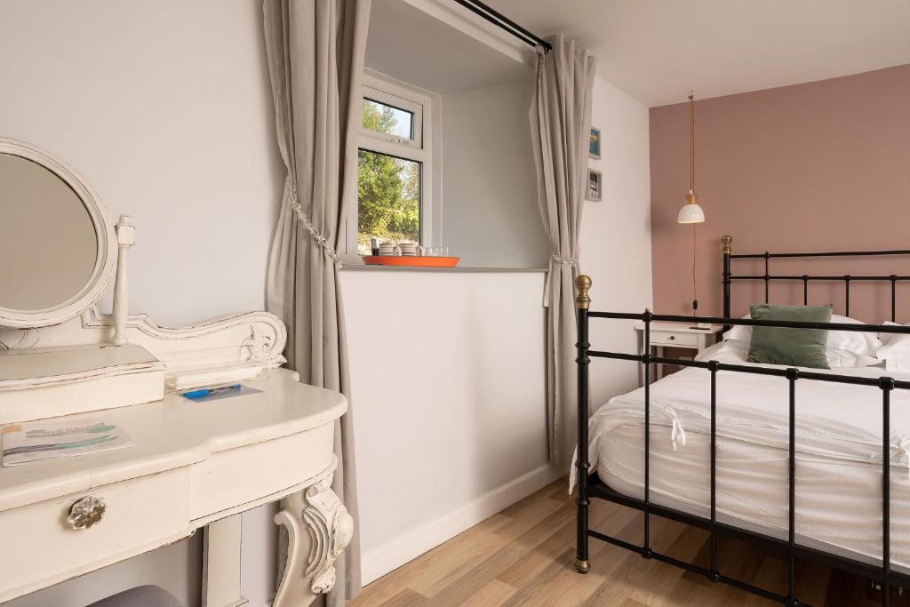Postel nebo postele na pokoji v ubytování Chillington House