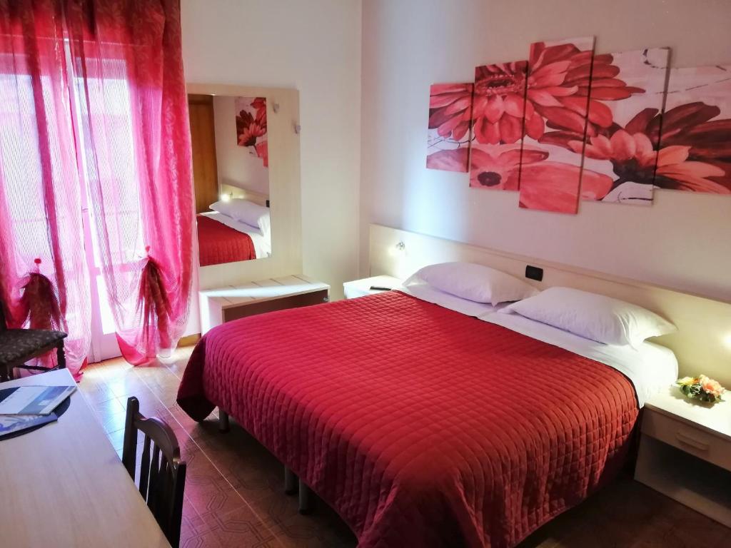 Postel nebo postele na pokoji v ubytování Albergo Neni