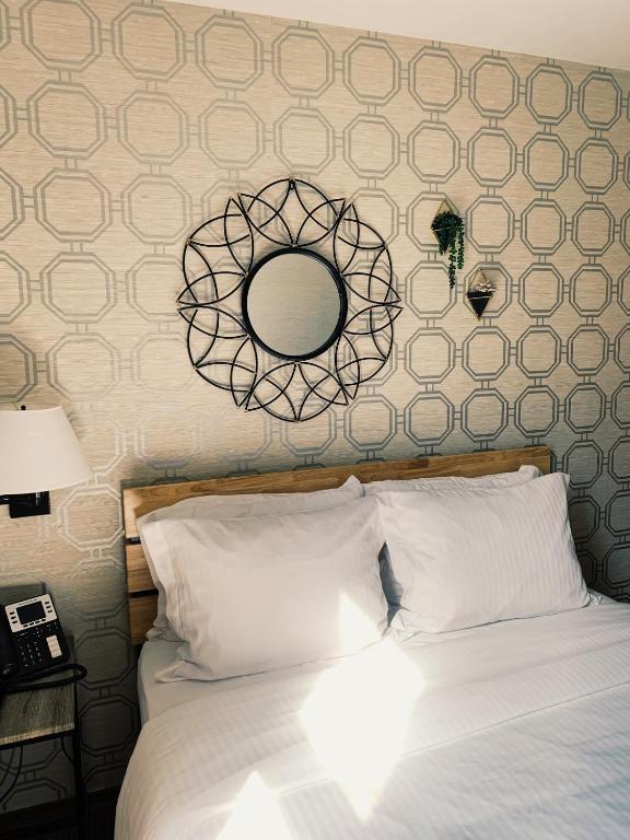 Posteľ alebo postele v izbe v ubytovaní Hotel Mimosa