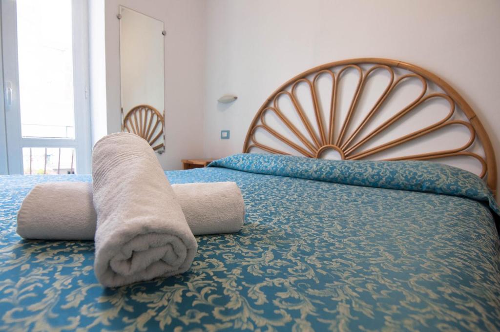 Postel nebo postele na pokoji v ubytování Albergo Macrì