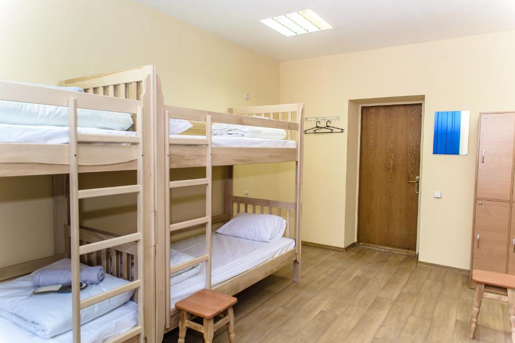 Postel nebo postele na pokoji v ubytování BOTANIC GLOBUS HOSTEL